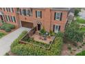 Aerial view of a brick patio with seating, surrounded by lush greenery and a manicured lawn at 1801 Maryland Ave, Charlotte, NC 28209