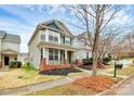 Attractive two-story home featuring a lovely front porch, landscaped yard, and inviting curb appeal at 18710 Coverdale Ct, Cornelius, NC 28031