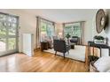 Bright living room with hardwood floors, neutral furniture, and ample natural light from the windows at 2144 Shadyview Dr, Charlotte, NC 28210