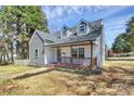 Charming two-story home with a welcoming front porch and dormer windows at 244 N Race St, Statesville, NC 28677