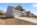 A two-story home features a two-car garage and neutral siding in a suburban neighborhood at 2953 Findley Rd, Statesville, NC 28625