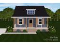 Charming home with blue siding, front porch, shutters, and a well-manicured lawn at 341 Bynum Ave, Rock Hill, SC 29732