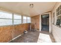 Bright sunroom featuring lots of windows, wood floors, and access to an attached room at 3467 Clearview Ln, Maiden, NC 28650