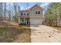 Two-story home featuring a two-car garage and porch at 411 Wintergreen Ct # 2, Kings Mountain, NC 28086