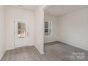 Bright foyer with white trim, grey flooring, and a view to the outside at 411 Wintergreen Ct # 2, Kings Mountain, NC 28086