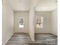 Bright, open room featuring attractive flooring, neutral walls, and a doorway leading to the outside at 418 Wintergreen Ct, Kings Mountain, NC 28086