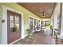 Welcoming front porch with a ceiling fan, comfortable seating, and a charming entryway at 426 Magnolia Ave, Charlotte, NC 28203