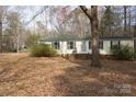 Attractive home with a well-manicured front lawn, offering a blend of comfort and suburban charm at 7597 Webbs Rd, Denver, NC 28037