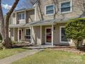 Close-up of a lovely townhome showcasing the front entry, lush lawn, and well-kept landscaping at 961 Sardis Cove Dr, Charlotte, NC 28270