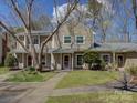 Inviting exterior view of a well-maintained townhome with a manicured lawn and sidewalk at 961 Sardis Cove Dr, Charlotte, NC 28270