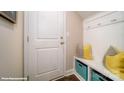 Convenient mud room featuring storage, seating, and hooks for organization near the entryway at 121 Asmodean Ln, Troutman, NC 28166