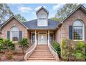 Welcoming front entrance with brick steps, white railings, and a beautiful double door at 126 Harbourtown Dr, Kings Mountain, NC 28086