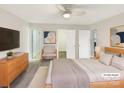 Virtually staged main bedroom with neutral tones, walk-in closet, and adjacent sitting area at 1313 Ridgewood Dr, Concord, NC 28027