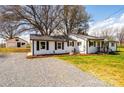 View of house and detached garage showing ample parking space at 1993 Moss Farm Rd, Hickory, NC 28602