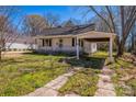 This home includes a useful carport and a classic backyard at 208 Columbia Ave, Rock Hill, SC 29730