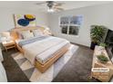 Serene bedroom with a large window, ceiling fan, and a cozy rug at 2115 Genesis Dr, Monroe, NC 28110