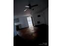 View of an empty living room with worn floors, offering potential for customization at 2124 Shoal Rd, Lincolnton, NC 28092