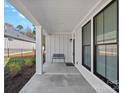 Inviting covered front porch with black trimmed windows at 218 Alenda Lux Cir, Mooresville, NC 28115