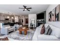 Open-concept living room and kitchen showcasing stylish furnishings and modern design at 242 Hamptons Cove Rd, Troutman, NC 28166