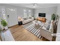 Bright and inviting living room with neutral tones and stylish contemporary furniture at 279 Timberland Loop, Mooresville, NC 28115