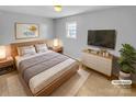 Cozy main bedroom with a comfortable bed, soft lighting, and minimalist decor at 279 Timberland Loop, Mooresville, NC 28115