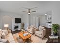 Inviting living room with modern decor, cozy seating, and an open floor plan to the kitchen at 426 W Ballard St, Cherryville, NC 28021