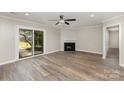 Cozy living area featuring a fireplace, sliding glass doors, and modern flooring at 7212 Hackberry Ln, Charlotte, NC 28226