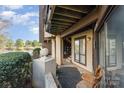 Covered porch and entryway featuring a view of the lake at 8175 Cedar Glen Dr, Charlotte, NC 28212