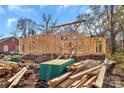 View of the new home construction with lumber and brick base on a clear day at 914 Saluda St, Rock Hill, SC 29730