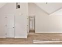 Unfinished hallway with wood flooring, white doors, and white trim at 914 Saluda St, Rock Hill, SC 29730
