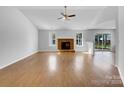 Open-concept living space with fireplace and abundant natural light at 1025 Ridgefield Cir, Indian Trail, NC 28079