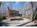 Scenic view of a beautiful home with a serene pond feature in the yard at 107 Grand Canyon Rd, Stanley, NC 28164