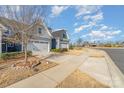 Attractive home featuring a neat lawn, attached garage, and a well-maintained sidewalk on a sunny day at 1108 Stella Ct, Monroe, NC 28110