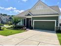 Charming home featuring a well-manicured lawn, beautiful landscaping, and a two-car garage at 1638 Sweetmoss Loop, Denver, NC 28037