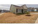Charming single-Gathering home featuring a brick and siding facade, a two-car garage, and a well-manicured lawn at 1638 Sweetmoss Loop, Denver, NC 28037