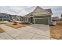 Charming single-Gathering home featuring a brick and siding facade, a two-car garage, and a well-manicured lawn at 1638 Sweetmoss Loop, Denver, NC 28037