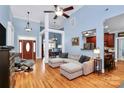Open-concept living room with hardwood floors, recessed lighting, and a comfortable sectional sofa at 1674 Wakefield Way, Rock Hill, SC 29730
