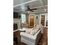 Cozy living room with coffered ceiling, fireplace, and comfortable seating at 203 S Washington St, Monroe, NC 28112