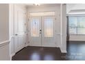 Bright foyer with double glass doors and hardwood floors at 2243 Creek View Ct, Indian Land, SC 29707