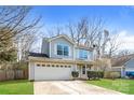 Charming two-story home with a well-manicured lawn, inviting entrance, and convenient two-car garage at 2627 Century Oaks Ln, Charlotte, NC 28262