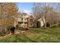 Beautiful two-story home with stone and siding, complemented by professional landscaping at 3196 Stonemill Path, Sherrills Ford, NC 28673