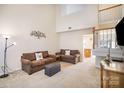 Bright and spacious living room with high ceilings, neutral carpet, and access to the staircase at 7361 Sun Dance Dr, Fort Mill, SC 29707