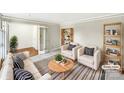 Bright, staged living room with modern decor, a striped rug and bookshelves at 755 Ottawa Dr, Rock Hill, SC 29732