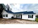 Charming single-story home with white siding, black shutters, covered front porch and well-kept lawn at 102 Guffey Rd, Cherryville, NC 28021