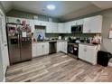 Modern kitchen featuring stainless steel appliances, granite countertops, and ample cabinet space at 102 Guffey Rd, Cherryville, NC 28021