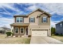 Charming two-story home showcasing a neutral color palette, well-maintained landscaping, and a two-car garage at 11203 Chapeclane Rd, Charlotte, NC 28278