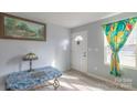 Bright entryway featuring stylish decor, a statement lamp, and natural light from a window at 1216 Center St, Wadesboro, NC 28170