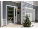 A modern townhome front entrance with a gray door, mailbox, and address number '1322' at 1322 Condon St, Charlotte, NC 28216