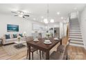 Open-concept living room and kitchen, perfect for entertaining with a dining table and a cozy sitting area at 1322 Condon St, Charlotte, NC 28216