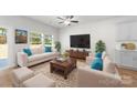 Inviting living room with ample natural light, featuring neutral decor and comfortable seating arrangements at 1322 Condon St, Charlotte, NC 28216